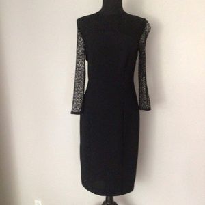 Black cocktail/evening dress with lacy sleeves and shoulders